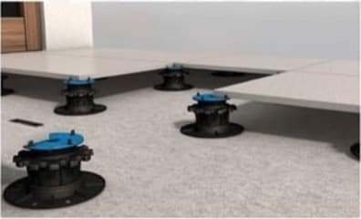 Arkimade pedestals supporting raised paving tiles