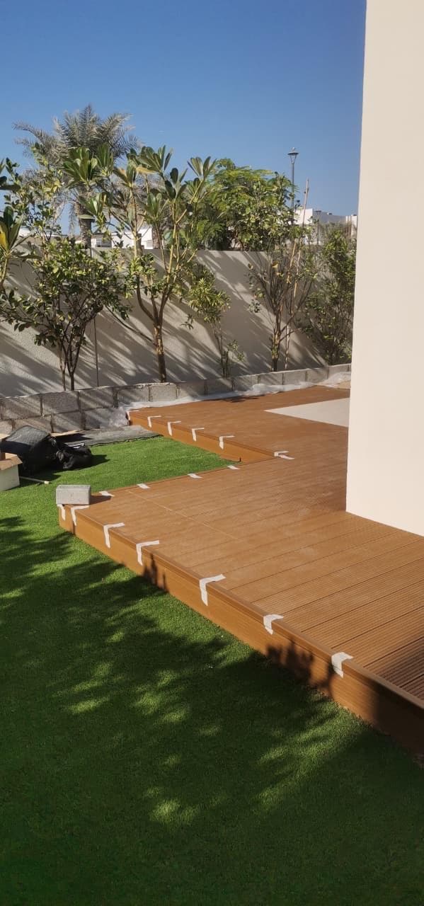 Timber decking installed on Arkimade pedestals in a garden